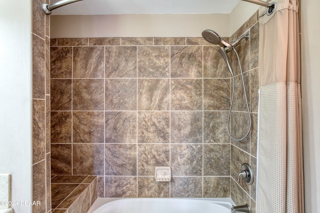 bathroom featuring shower / tub combo with curtain