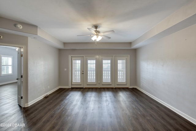 spare room with ceiling fan and dark hardwood / wood-style floors