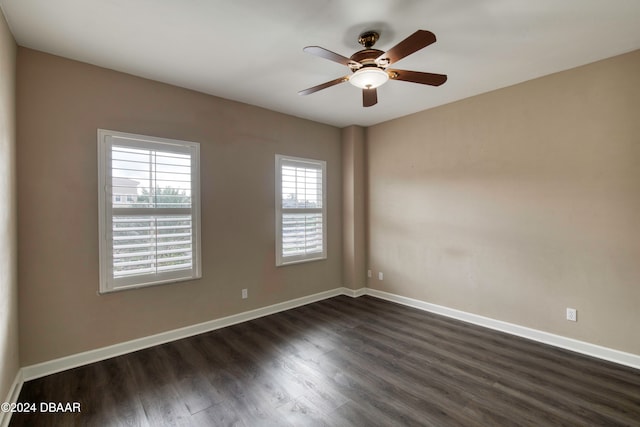 unfurnished room featuring ceiling fan and dark hardwood / wood-style floors