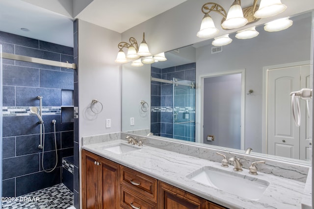 bathroom with vanity and an enclosed shower