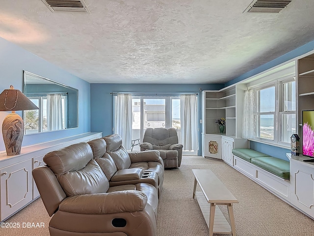 1926 Ocean Shore Blvd Unit 3120, Ormond Beach, FL 32176 - living room featuring a wealth of natural light, light carpet, and visible vents