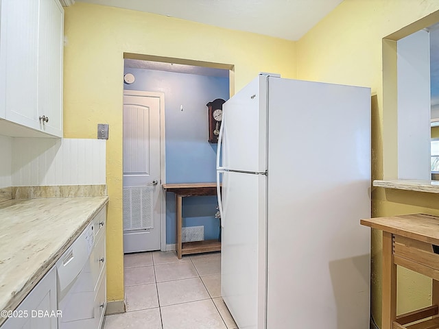 1926 Ocean Shore Blvd Unit 3120, Ormond Beach, FL 32176 - kitchen featuring white cabinetry, white appliances, light countertops, and light tile patterned floors