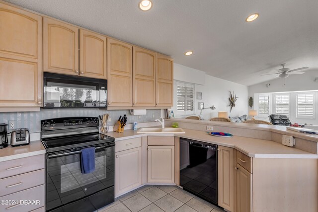 kitchen with lofted ceiling, black appliances, sink, light tile patterned floors, and ceiling fan