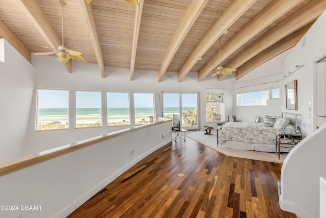 unfurnished bedroom featuring lofted ceiling with beams, dark wood-type flooring, a water view, wooden ceiling, and ceiling fan