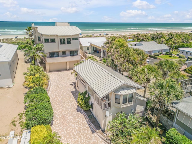 birds eye view of property featuring a view of the beach and a water view