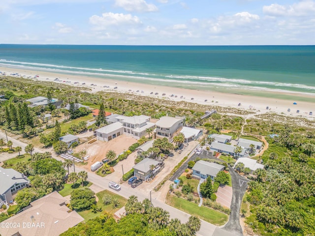 bird's eye view featuring a view of the beach and a water view