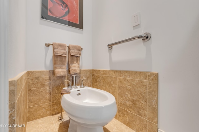 bathroom featuring tile walls, tile patterned flooring, and a bidet