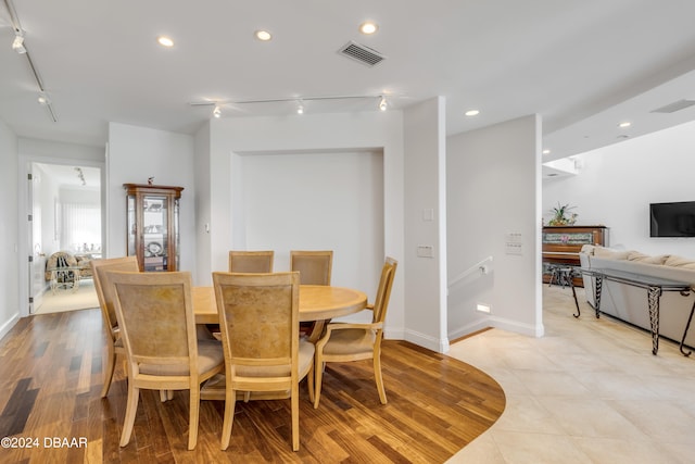 dining area with light hardwood / wood-style floors