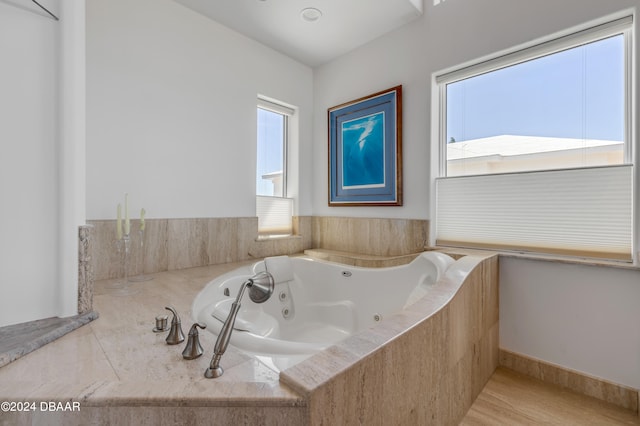 bathroom with tiled bath