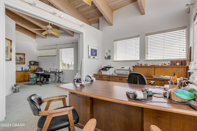 carpeted office space with vaulted ceiling with beams, ceiling fan, and wooden ceiling