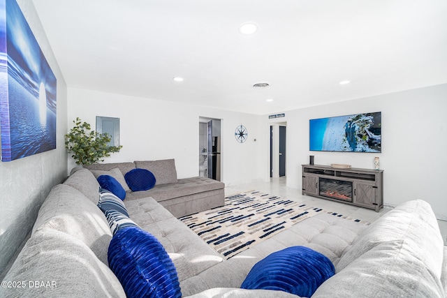 tiled living room featuring recessed lighting and visible vents