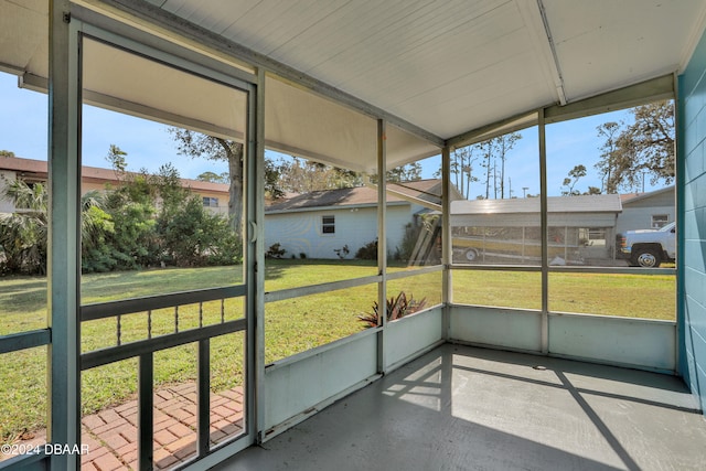 unfurnished sunroom with a wealth of natural light