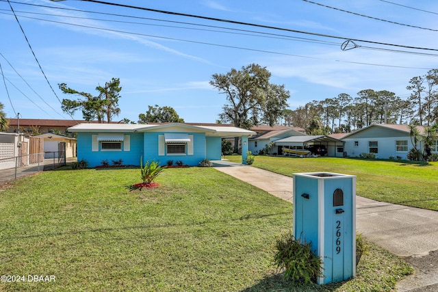 single story home featuring a front yard