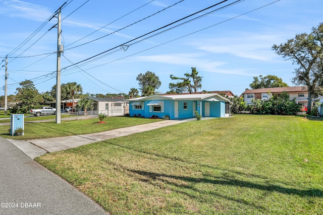 ranch-style home with a front yard