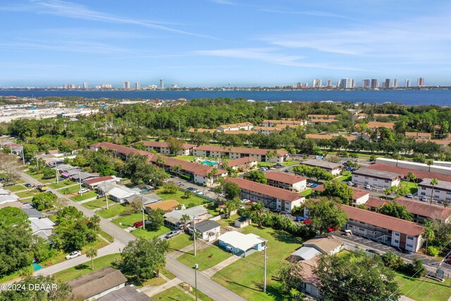 birds eye view of property with a water view