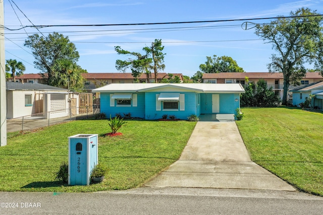 ranch-style home with a front lawn