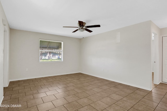 tiled empty room with ceiling fan