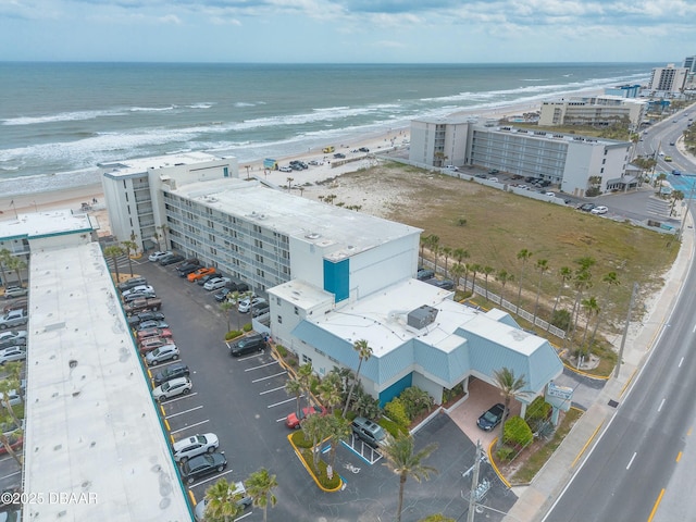 aerial view with a view of the beach, a view of city, and a water view