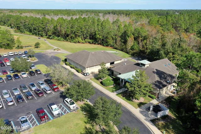 bird's eye view featuring a wooded view