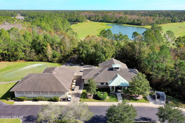 drone / aerial view featuring a forest view, golf course view, and a water view