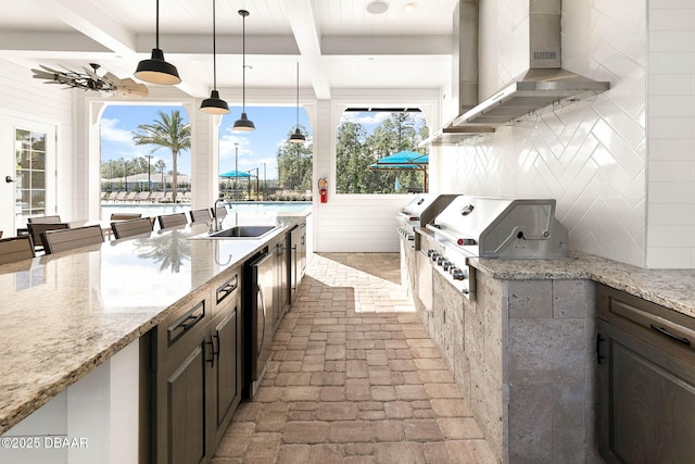 view of patio / terrace featuring a ceiling fan, a sink, and area for grilling