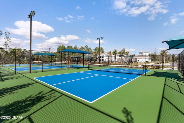 view of sport court with fence