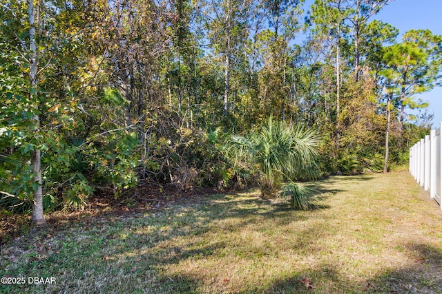 view of yard featuring fence