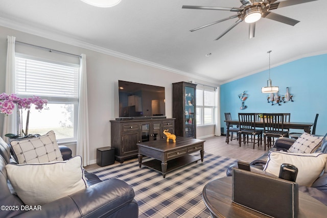 living room featuring crown molding, vaulted ceiling, ceiling fan, and wood finished floors