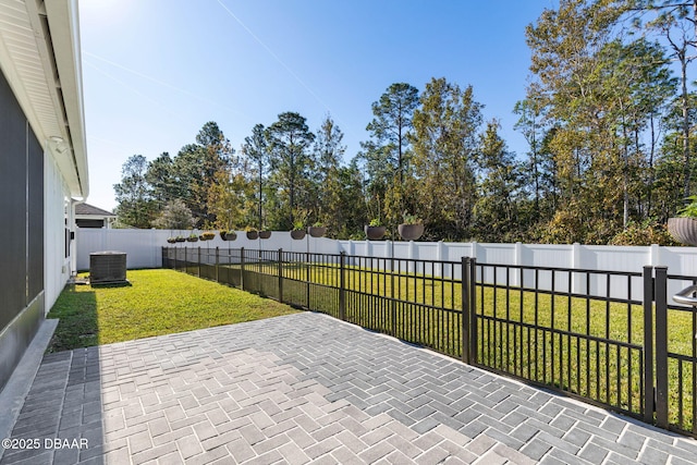 view of patio with a fenced backyard and central AC