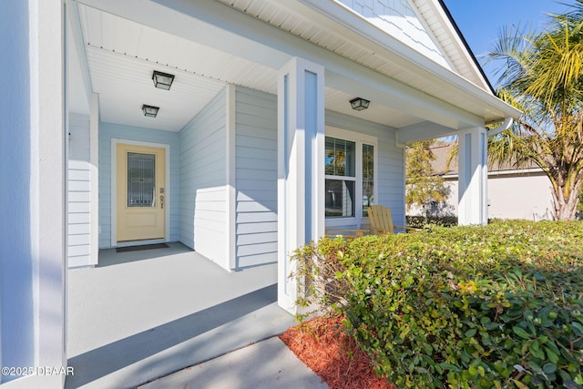 doorway to property with a porch