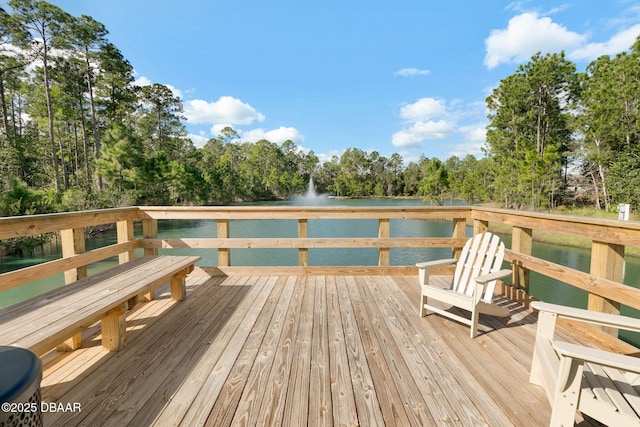 wooden deck featuring a water view