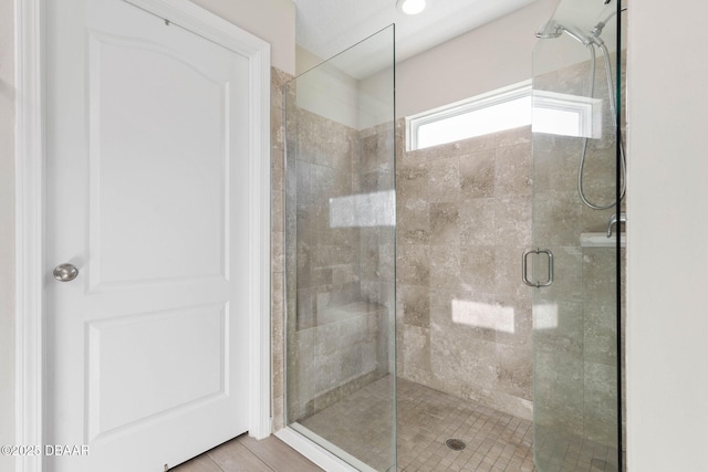 full bath featuring a shower stall