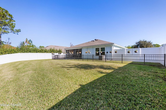 view of yard with a fenced backyard