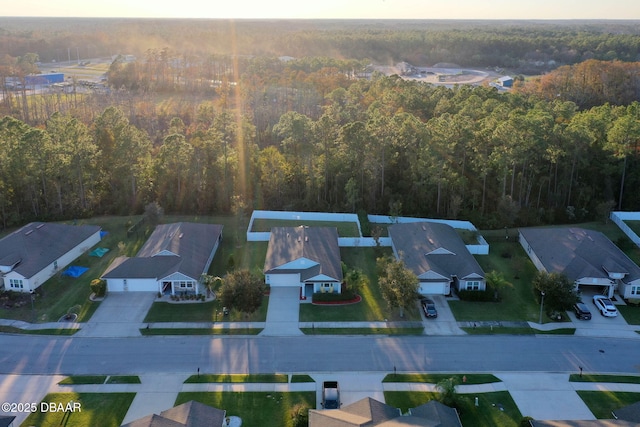 aerial view with a residential view and a view of trees