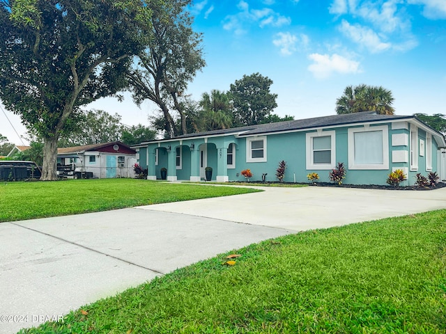 single story home featuring a front yard