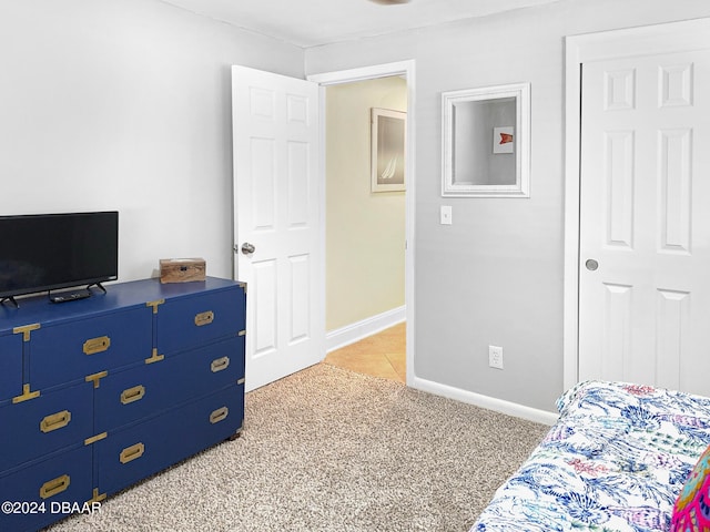 bedroom featuring light carpet