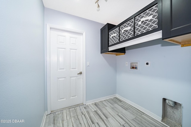 laundry room with light hardwood / wood-style floors, cabinets, hookup for a washing machine, and electric dryer hookup