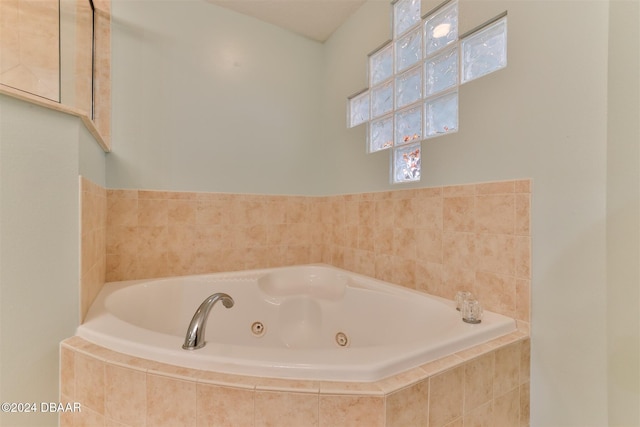 bathroom featuring a relaxing tiled tub