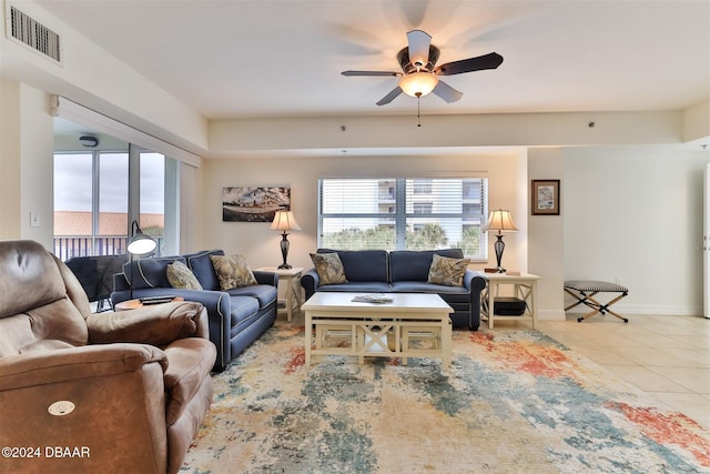 living room featuring ceiling fan and light tile patterned flooring