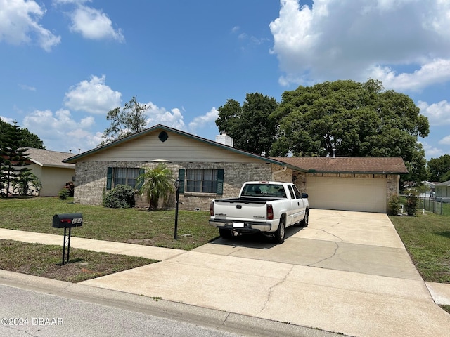 ranch-style house with a garage and a front yard