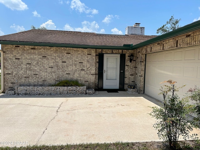 property entrance with a garage