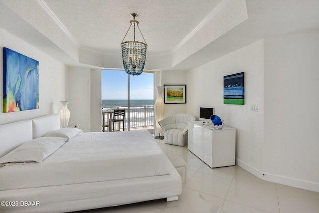 tiled bedroom featuring ornamental molding, access to outside, a tray ceiling, an inviting chandelier, and baseboards