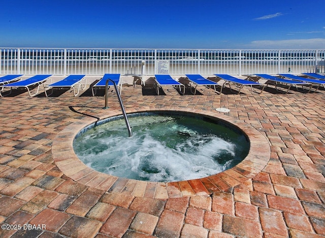 view of swimming pool with a community hot tub