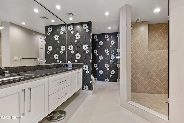 full bathroom featuring tile patterned floors, visible vents, a sink, recessed lighting, and walk in shower