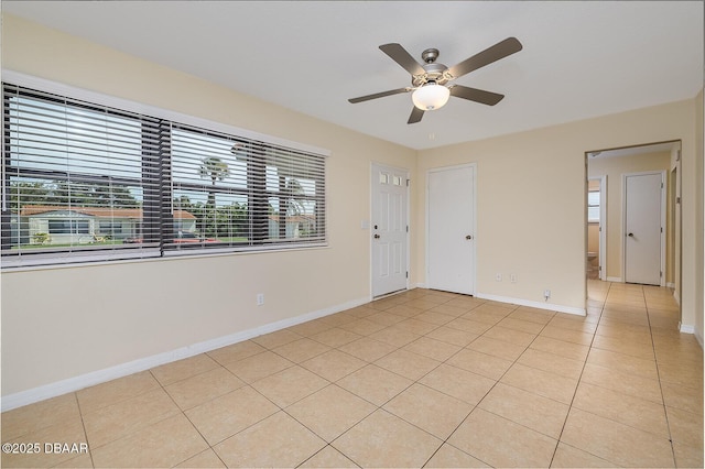 59 Cardinal Dr Unit A, Ormond Beach, FL 32176 - empty room featuring light tile patterned floors and a ceiling fan