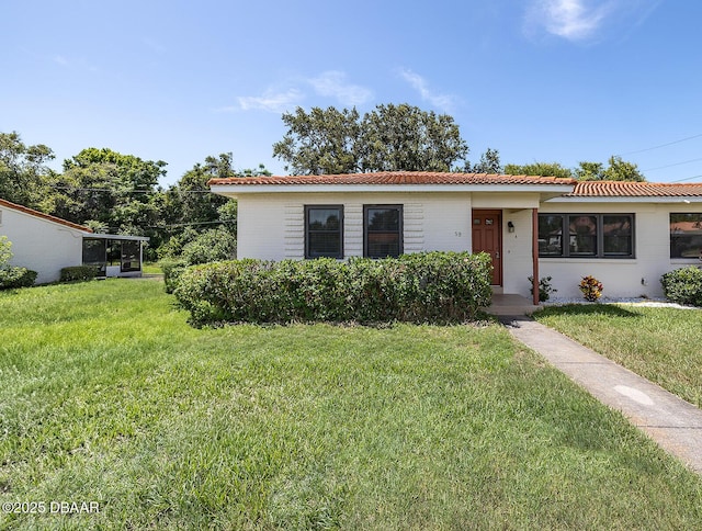 59 Cardinal Dr Unit A, Ormond Beach, FL 32176 - view of front of home with a front lawn and brick siding