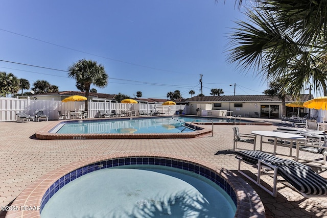 59 Cardinal Dr Unit A, Ormond Beach, FL 32176 - community pool featuring a hot tub and a patio
