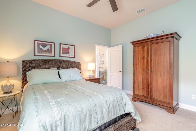 bedroom with baseboards, ceiling fan, visible vents, and light carpet