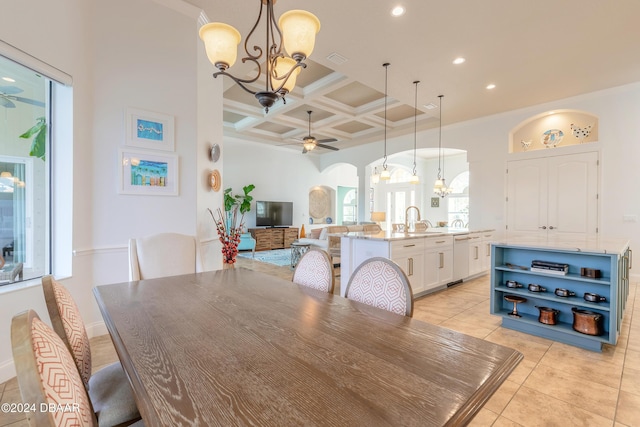 dining room featuring coffered ceiling, recessed lighting, light tile patterned floors, ceiling fan with notable chandelier, and arched walkways