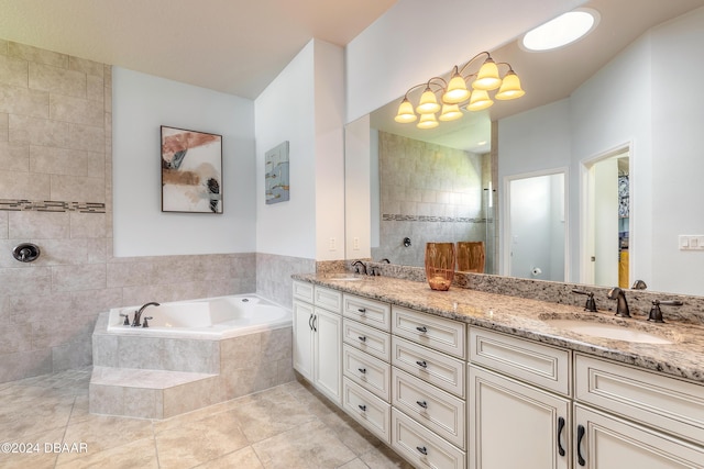 bathroom with a bath, walk in shower, double vanity, tile patterned floors, and a sink